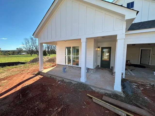 a lobby with furniture and chandelier