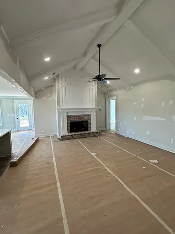 a living room with a fireplace and a fireplace