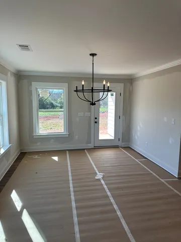 a view of empty room with windows