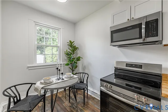 a workspace with furniture window and wooden floor