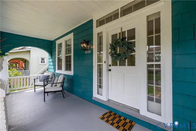 a dining room with furniture and wooden floor