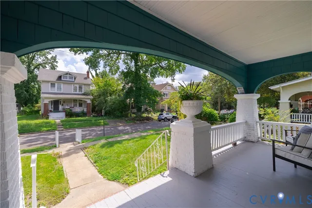 a living room with furniture a fireplace and a table