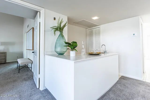 a kitchen with stainless steel appliances a refrigerator sink and cabinets