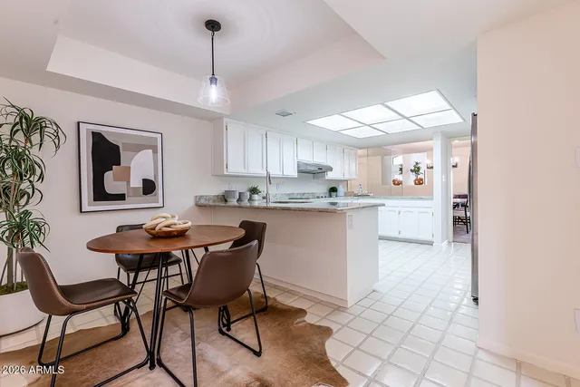 a bathroom with a double vanity sink and mirror