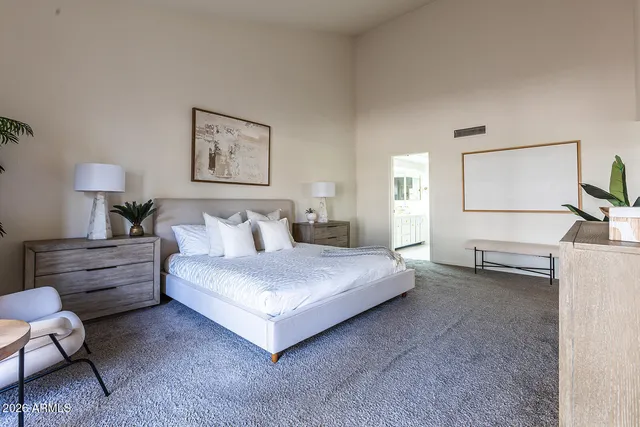 a bathroom with a tub shower and sink