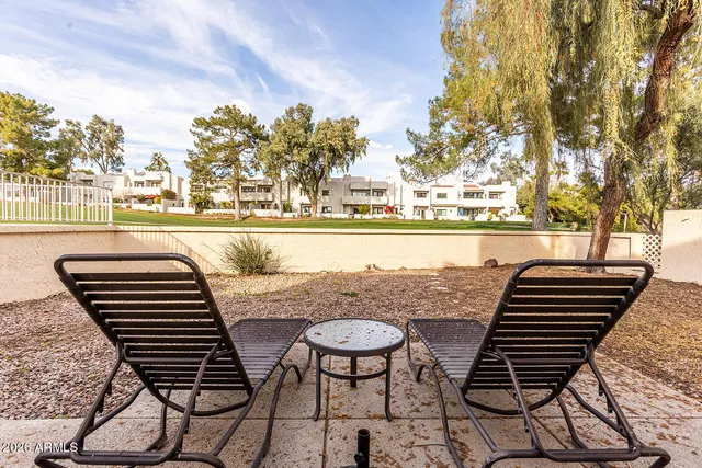 a bathroom with a double vanity sink toilet and shower