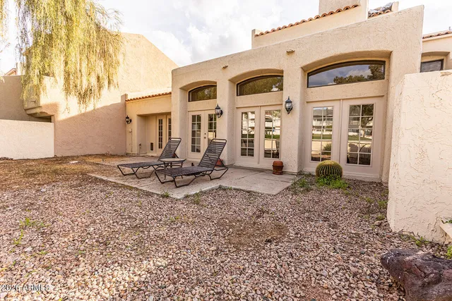 a view of staircase with a rug and a glass door