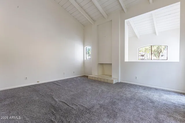 a view of a street with a tree