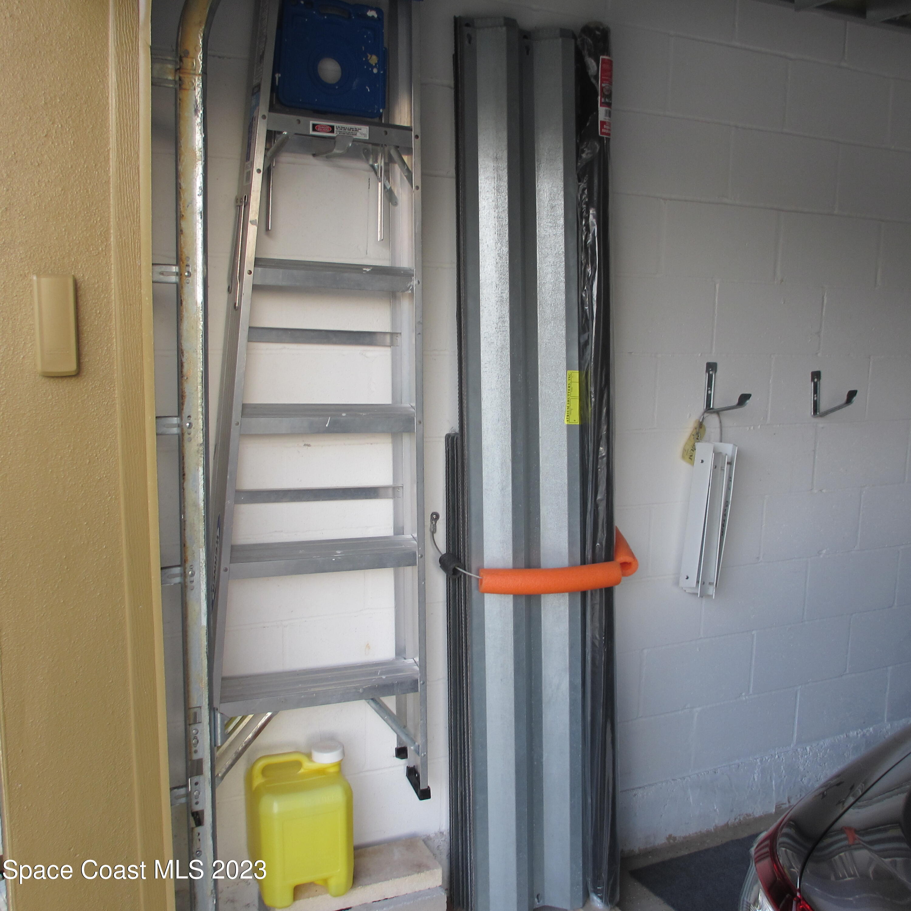 1925 Canopy Drive Melbourne, FL 32935 - Photo 12 of 17 a view of walk in closet with clothes and shoes