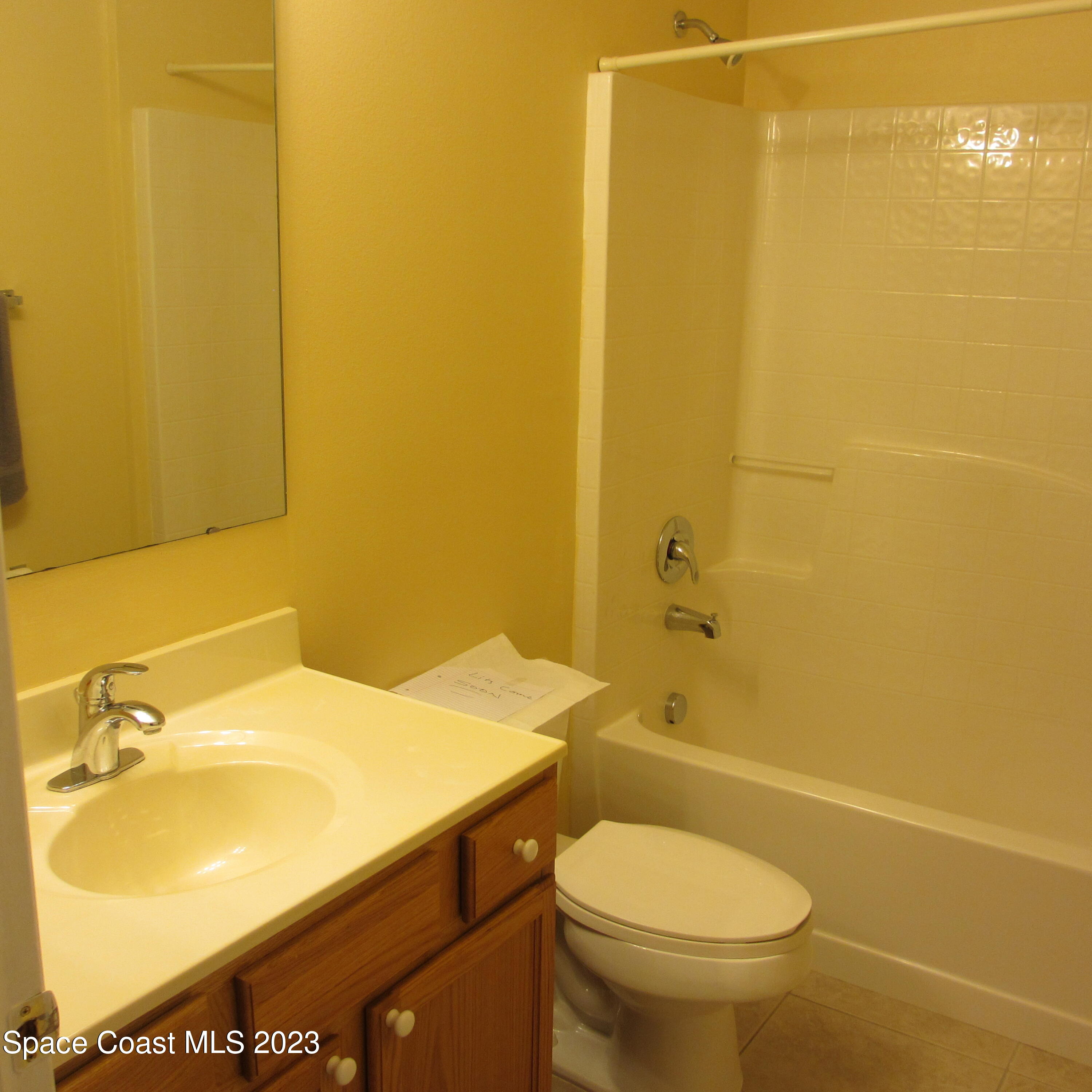 1925 Canopy Drive Melbourne, FL 32935 - Photo 13 of 17 a bathroom with a sink a toilet and shower