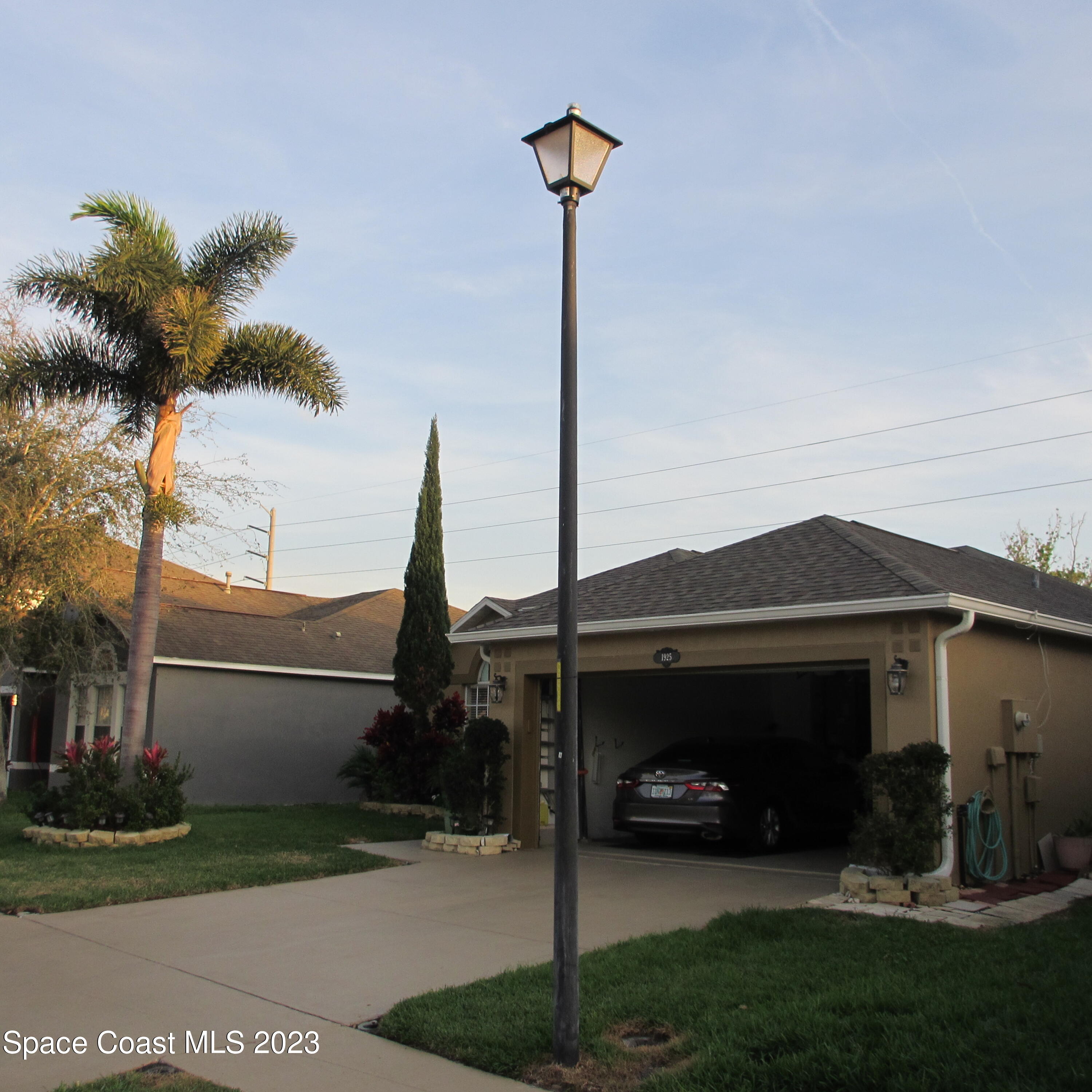 1925 Canopy Drive Melbourne, FL 32935 - Photo 4 of 17 a front view of a house with garden