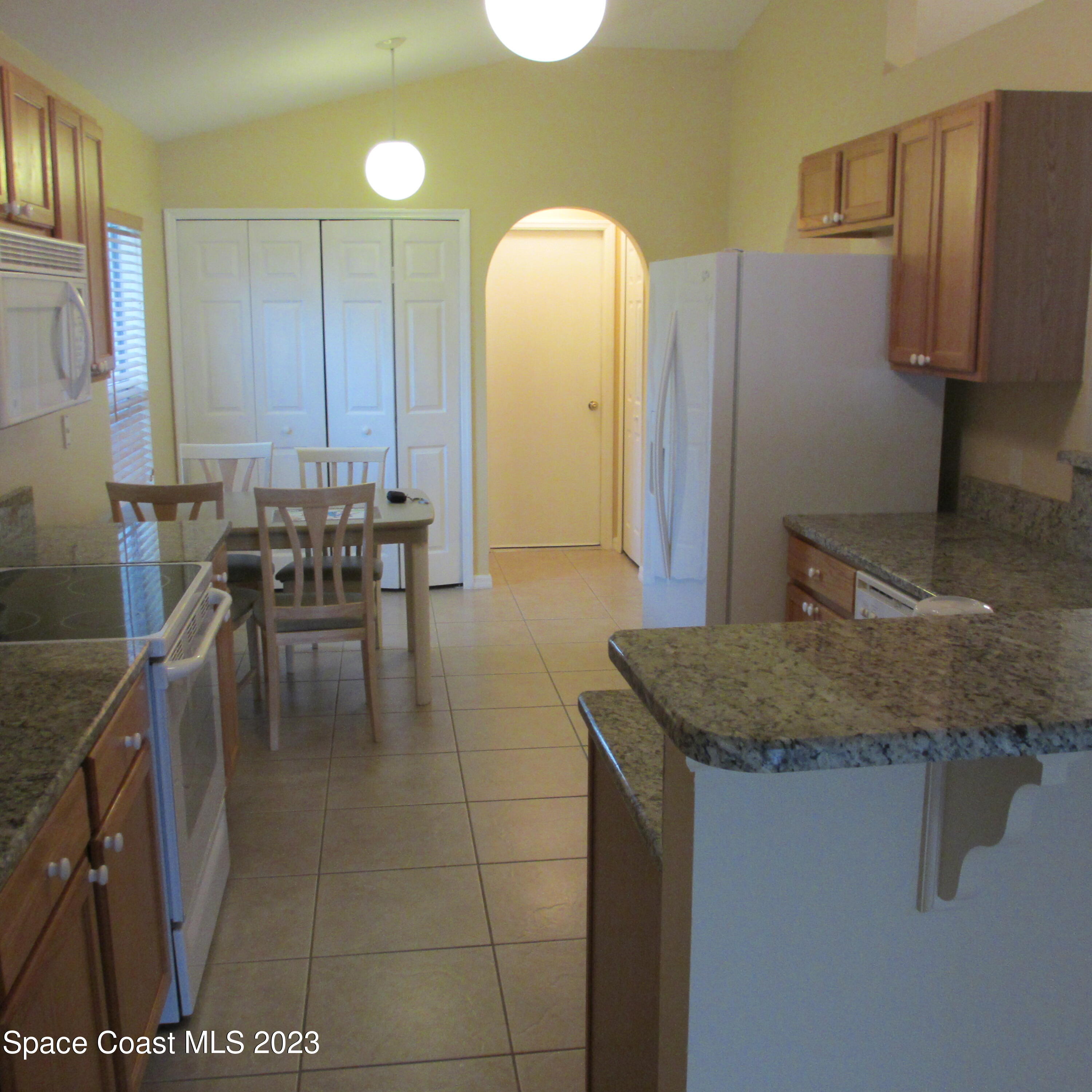 1925 Canopy Drive Melbourne, FL 32935 - Photo 7 of 17 a kitchen with a sink a counter top space and cabinets