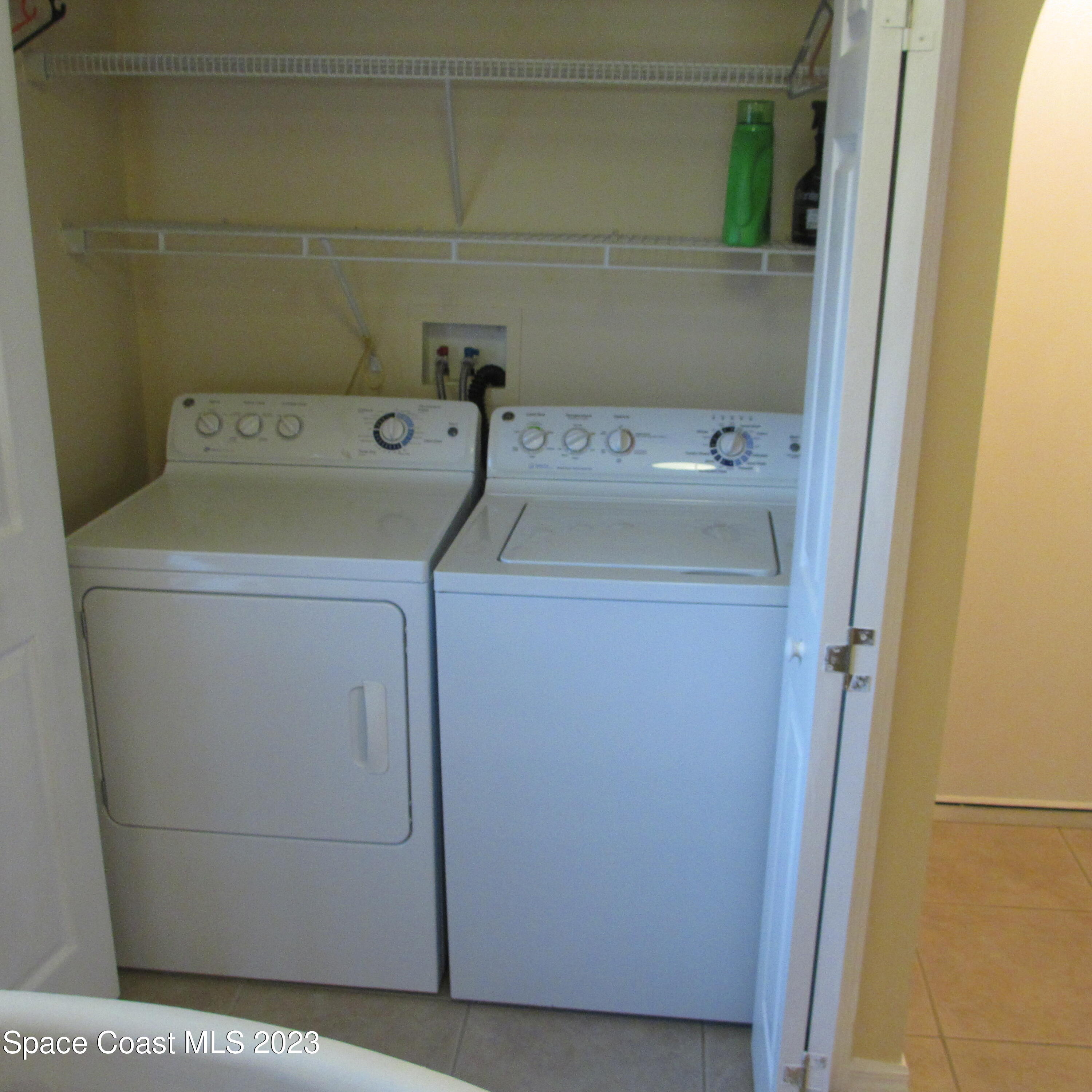 1925 Canopy Drive Melbourne, FL 32935 - Photo 8 of 17 a utility room with dryer and washer
