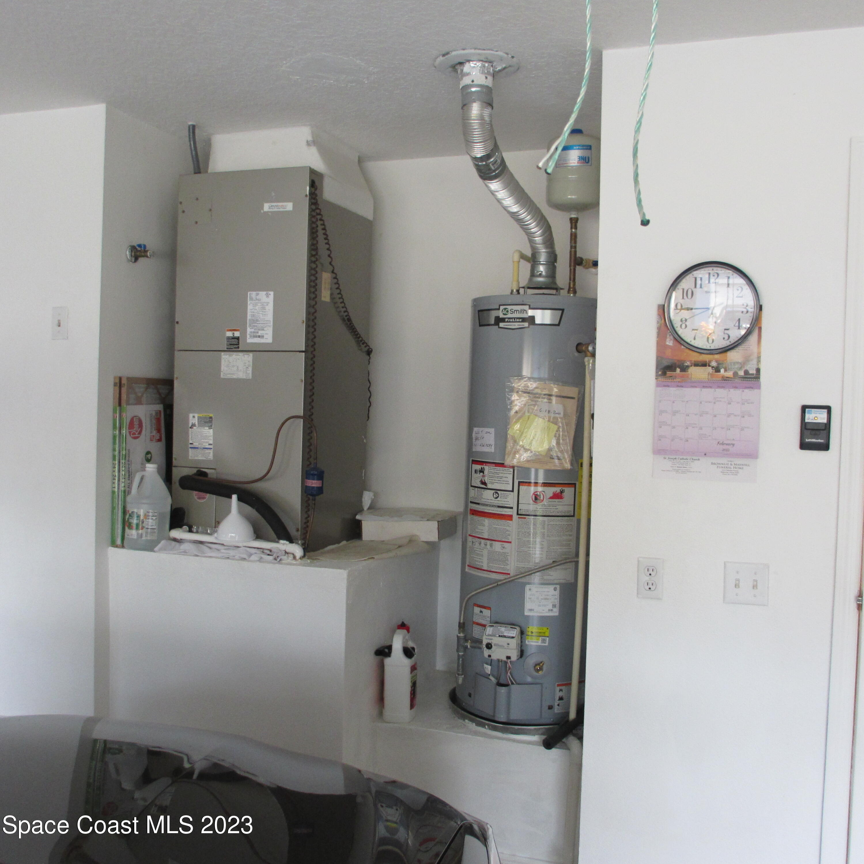 1925 Canopy Drive Melbourne, FL 32935 - Photo 9 of 17 a room with a refrigerator and cabinets