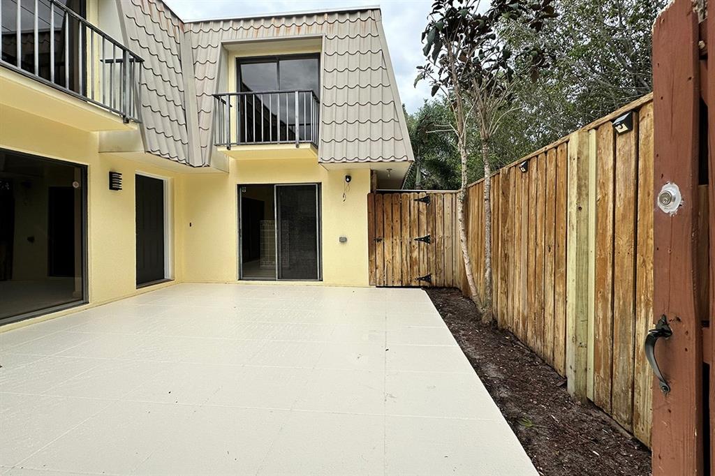 1700 Embassy Drive, Unit 402 West Palm Beach, FL 33401 - Photo 1 of 38 a view of a front door and wooden door