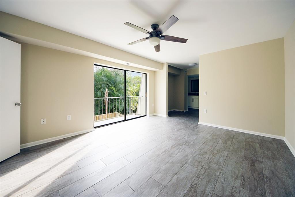 1700 Embassy Drive, Unit 402 West Palm Beach, FL 33401 - Photo 18 of 38 a view of an empty room with a window