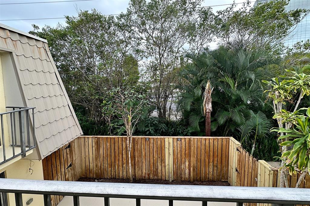 1700 Embassy Drive, Unit 402 West Palm Beach, FL 33401 - Photo 25 of 38 a view of balcony with wooden floor