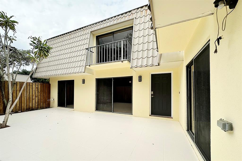 1700 Embassy Drive, Unit 402 West Palm Beach, FL 33401 - Photo 33 of 38 a view of a house with a outdoor space