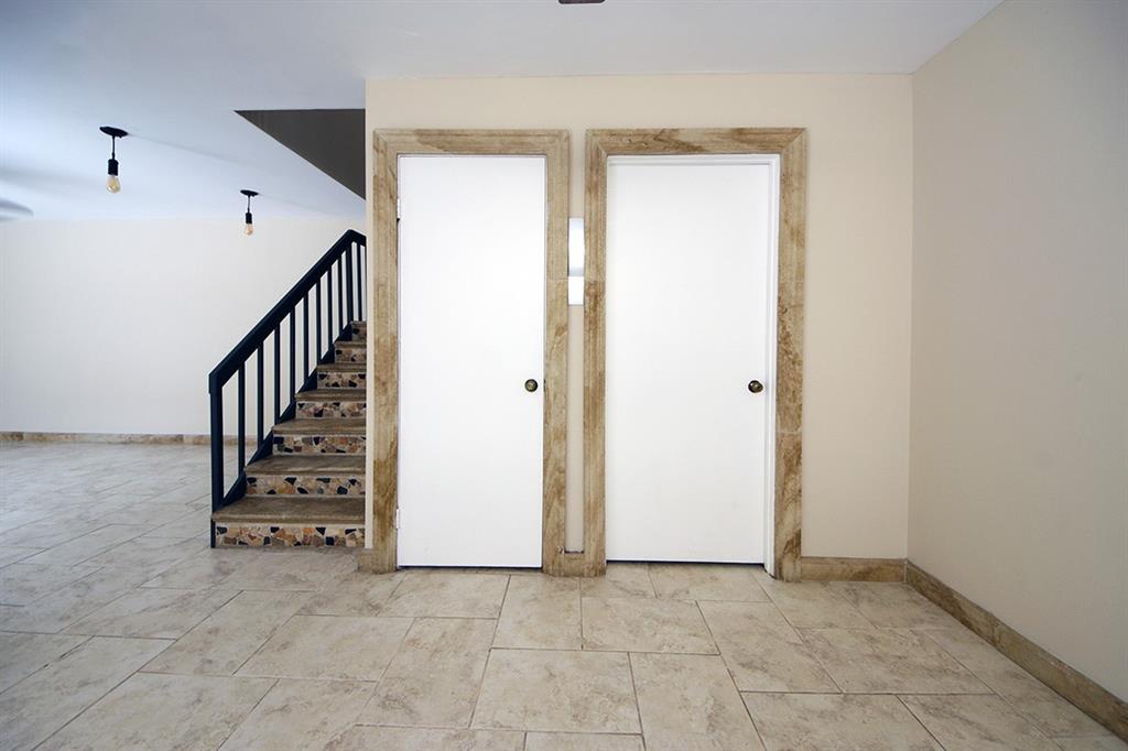1700 Embassy Drive, Unit 402 West Palm Beach, FL 33401 - Photo 7 of 38 a view of an entryway with hallway