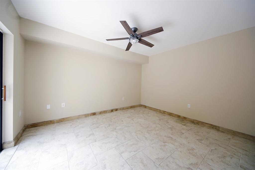 1700 Embassy Drive, Unit 402 West Palm Beach, FL 33401 - Photo 8 of 38 an empty room