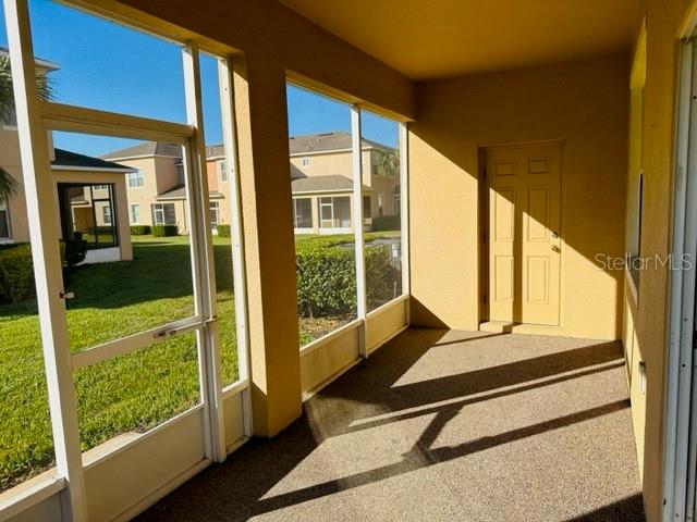1276 Priory Circle Winter Garden, FL 34787 - Photo 16 of 37 a floor to ceiling window with wooden floor