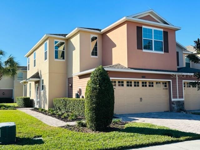 1276 Priory Circle Winter Garden, FL 34787 - Photo 2 of 37 a front view of a house with a yard