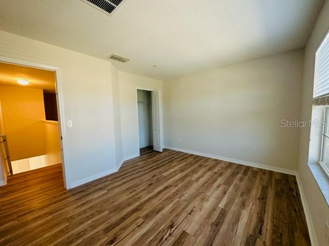 1276 Priory Circle Winter Garden, FL 34787 - Photo 22 of 37 a view of bedroom with wooden floor
