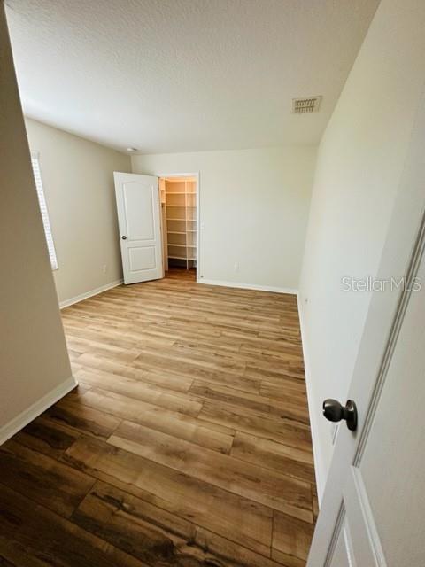 1276 Priory Circle Winter Garden, FL 34787 - Photo 28 of 37 a view of a room with wooden floor