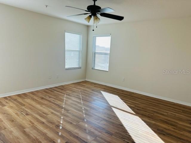 1276 Priory Circle Winter Garden, FL 34787 - Photo 32 of 37 a view of empty room with wooden floor and fan
