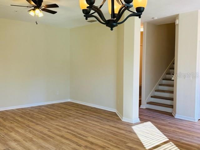 1276 Priory Circle Winter Garden, FL 34787 - Photo 6 of 37 a view of a room with wooden floor and white walls