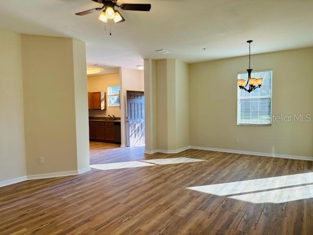 1276 Priory Circle Winter Garden, FL 34787 - Photo 10 of 37 a view of an empty room with kitchen and a window