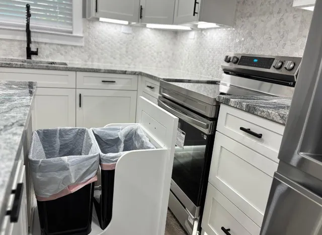 a kitchen with table and chairs