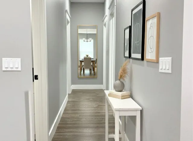 a room that has a bed and a table in it