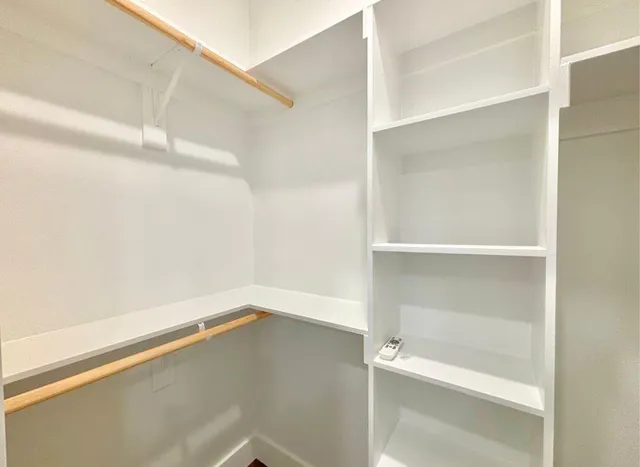 a view of an empty walk in closet
