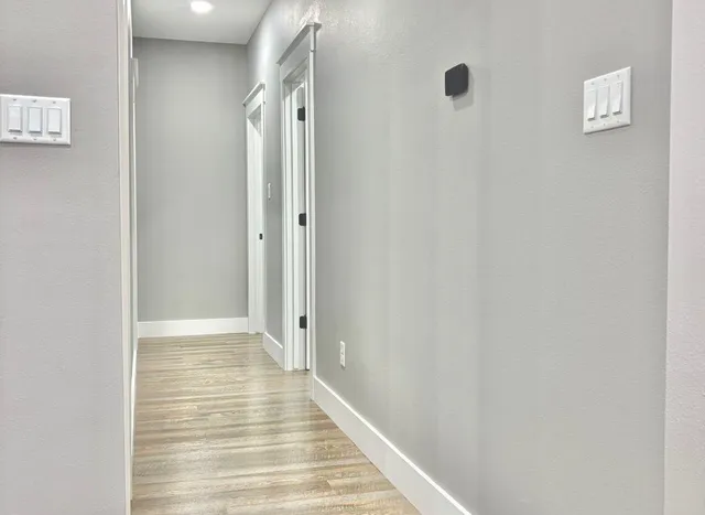 a view of a bathroom from the hallway