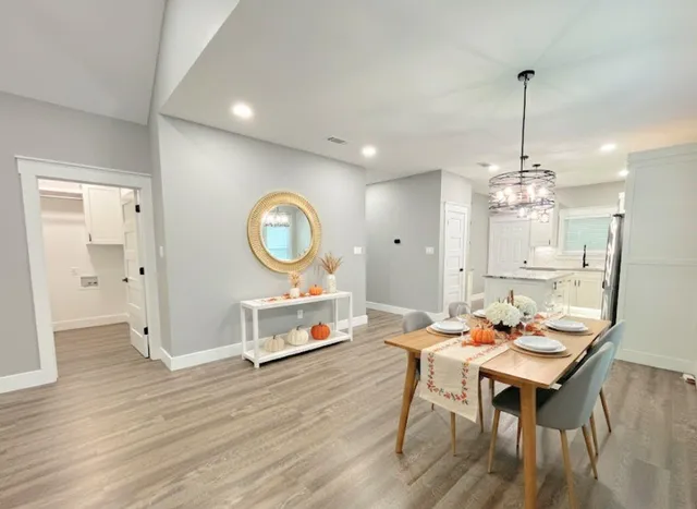 a view of a dining room with furniture window and wooden floor