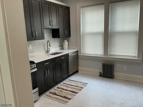 an empty room with windows and table