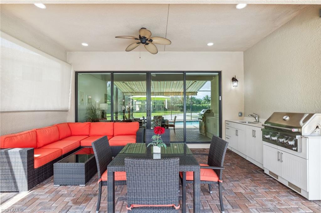4360 Aurora Street Naples, FL 34119 - Photo 13 of 49 Outdoor oasis with kitchen and covered lanai space