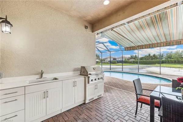 a spacious bathroom with a double vanity sink and a large mirror