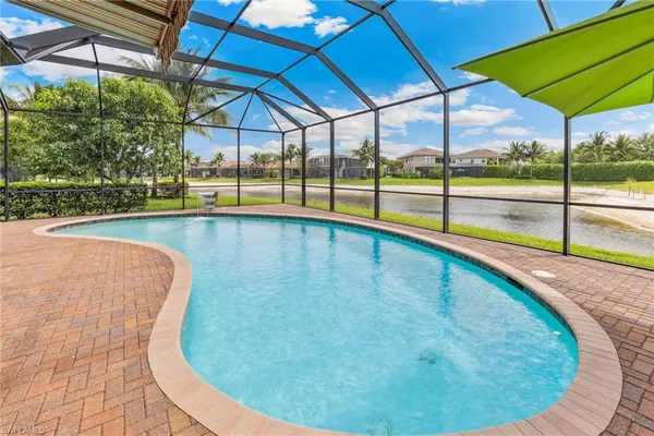 a view of a swimming pool with a porch