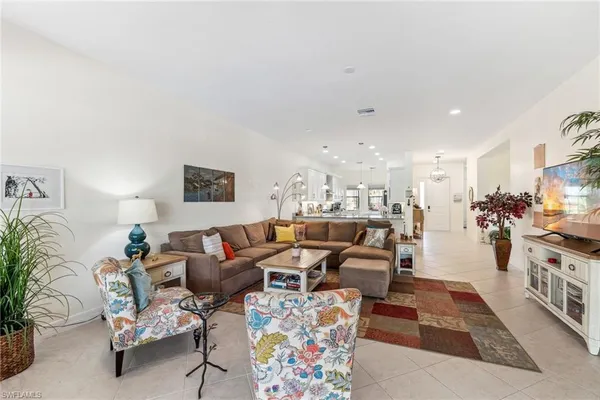 a living room with furniture and a table
