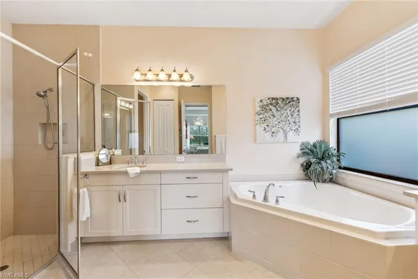 a bathroom with a bathtub and a sink