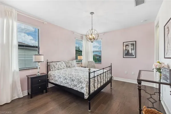 a bedroom with a bed window and furniture