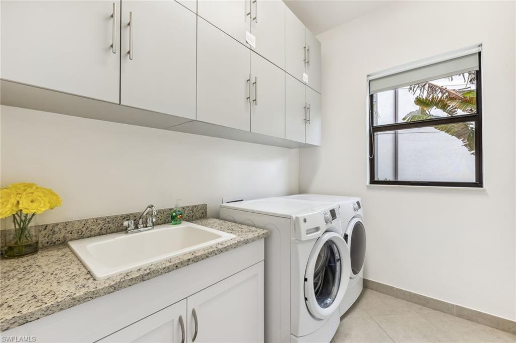 4360 Aurora Street Naples, FL 34119 - Photo 30 of 49 1st floor laundry room with extra storage room under staircase