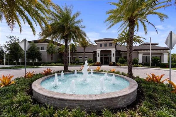 a view of a house with swimming pool and porch with furniture