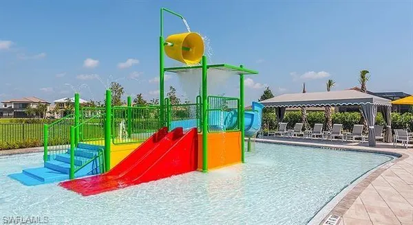 a view of a swimming pool with a lounge chairs