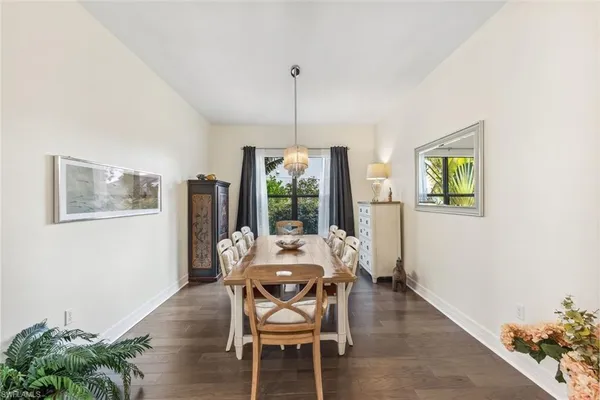 a dining room with furniture and window
