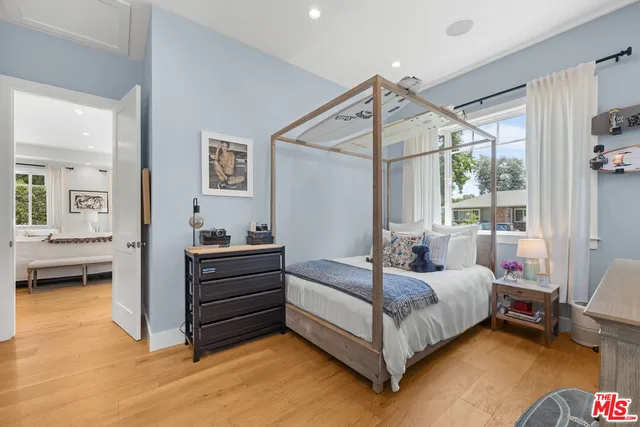 a bed room with a bed and a window