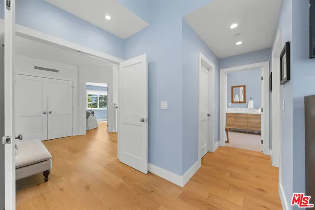 a bedroom with a bed and a table in it