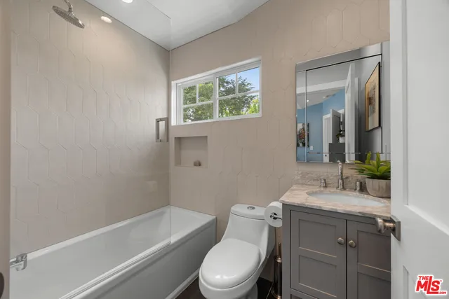 a view of a house with swimming pool and sitting area